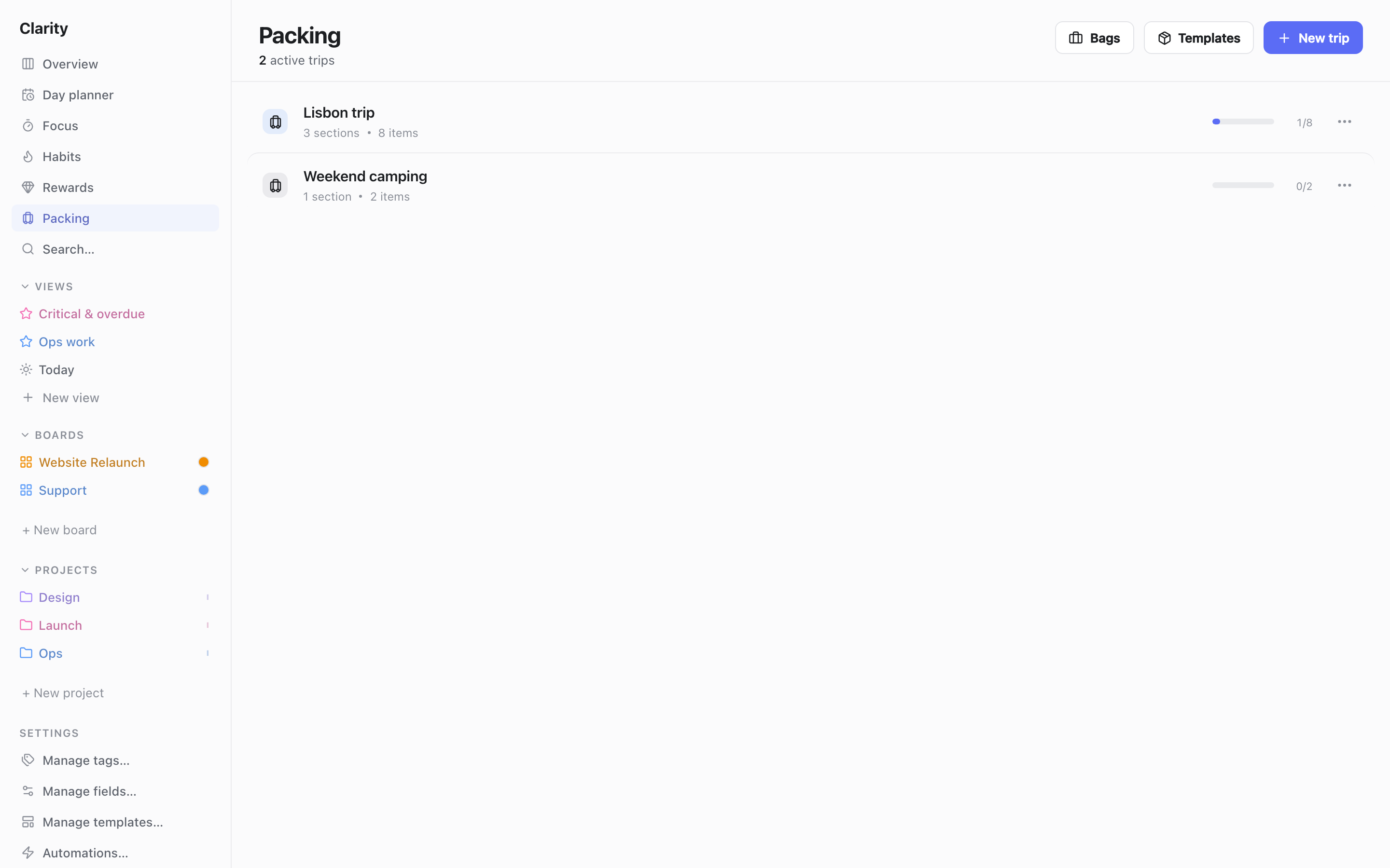 The Packing page listing two trips, "Lisbon trip" (3 sections, 8 items) and "Weekend camping" (1 section, 2 items), each with a progress bar